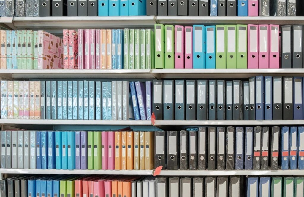 qtq80-9RGBsY a colour coded bookshelf of binders